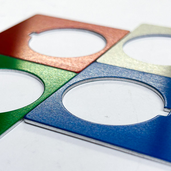 anodized metal cutouts of various colors